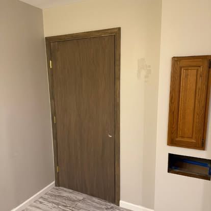 Interior wood door with fresh trim